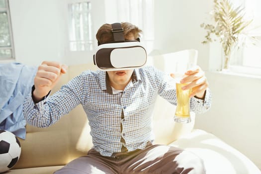 The man with glasses of virtual reality at home. Future technology concept.