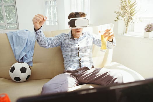 The man with glasses of virtual reality at home. Future technology concept.