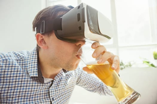 The man with glasses of virtual reality at home. Future technology concept.