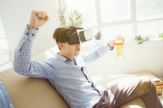 The man with glasses of virtual reality at home. Future technology concept.