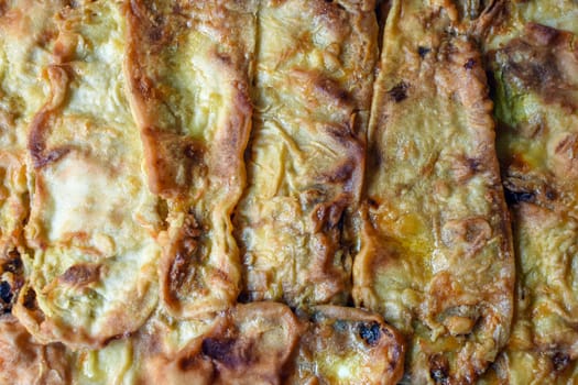 Close-up photo about baked food from zucchini.