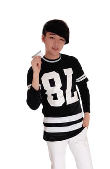 A handsome young Asian teenager standing in a black t-shirt.holding his credit card to spend money, isolated for white background..