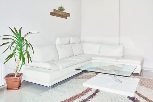 Sofa and Glass Table in the Corner of the Room