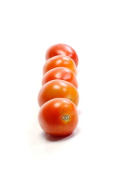 Five tomatoes on white background. Look tasty and fresh