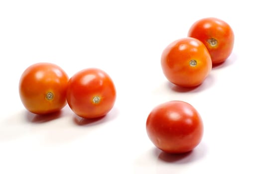 Five tomatoes on white background. Look tasty and fresh