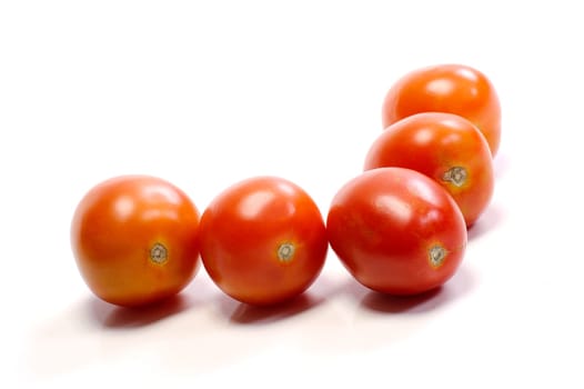 Five tomatoes on white background. Look tasty and fresh