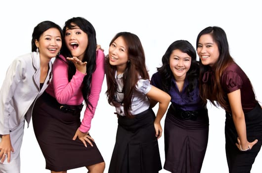 Happy group of attractive young women smiling isolated on white background