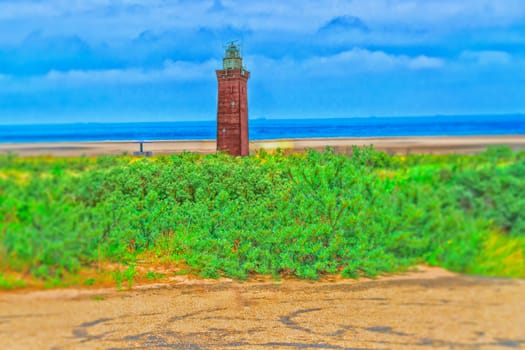 Artistic work by myself. Deliberate blurring in this design. Old postcard.. Dune panorama on the North Sea coast in Holland with dramatic skies.