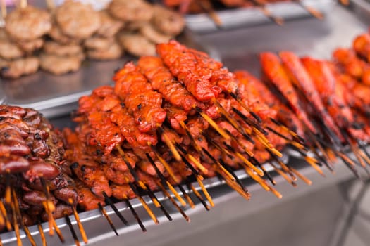 Grill pork in bamboo stick , street food of Thailand.