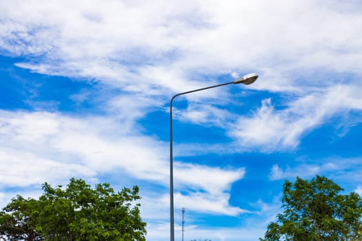Street lamp on blue sky background