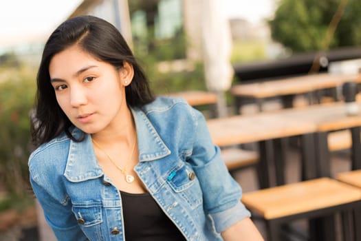 Beautiful young Asian woman in the cafe