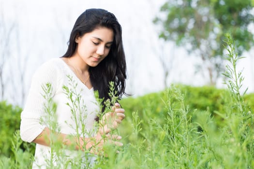 Outdoor portrait asian girl in the flowers garden