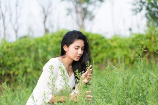 Outdoor portrait asian girl in the flowers garden