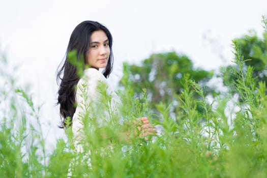 Outdoor portrait asian girl in the flowers garden