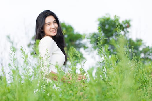 Outdoor portrait asian girl in the flowers garden