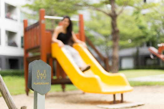 Children playground, yellow blue slider