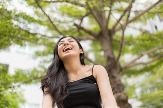 A portrait of a beautiful asian woman smiling