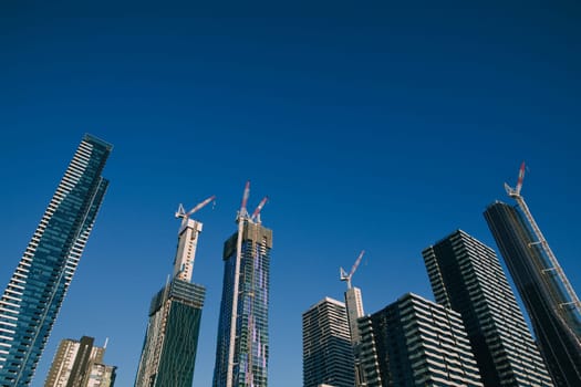 Cityscape of skyscrapers with cranes in Melbourne, Australia