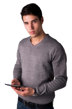 Handsome young man holding ebook reader and looking at camera, standing isolated on white background
