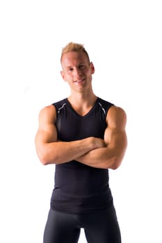 Muscular male model smiling, posing with a lot of confidence, arms crossed on his chest, isolated on white