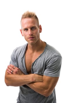 Muscular male model smiling, posing with a lot of confidence, arms crossed on his chest, isolated on white