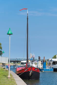 DEVENTER, NETHERLANDS - AUGUST 27, 2016: Fishing trawler with Urker registration number. Urk has by far the largest fishing fleet and fish processing industry in the Netherlands.