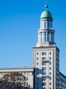 View of the south tower at the Fankfurter Tor with blue sky in Berlin in 2017. This tower includes the "Lounge in the Tower"" with conference and meeting rooms."