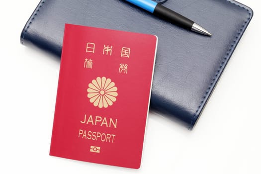 japan passport and leather notebook isolated on white background