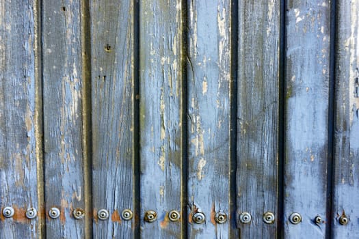 Weathered wooden boards screwed in detail as a background