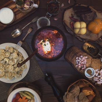 Russian food: borsch pickles cheese meat dumplings and fat