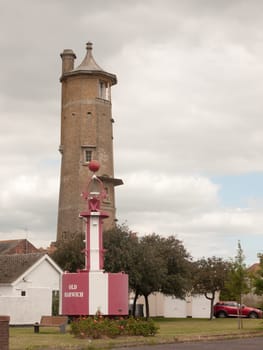tower and red and white sea structure outside on cloudy day in harwich port