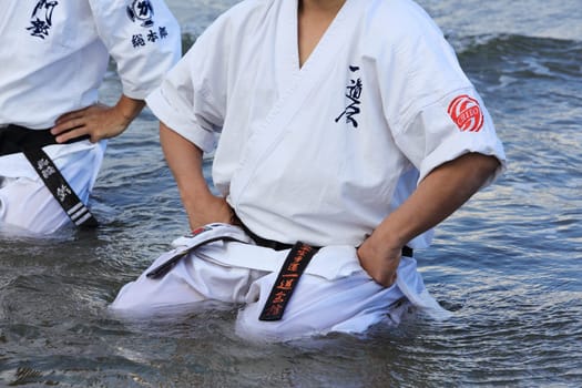 Kagawa, Japan - January 3, 2017: Japanese martial arts houses sports competitions, sit in meditation pose on the Ichinomiya Beach.