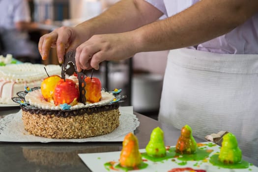 Manual cakes production on factory