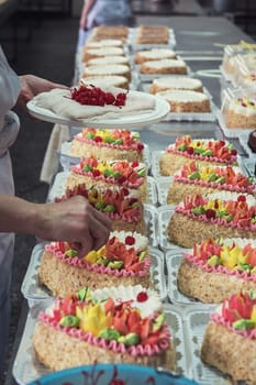 Manual cakes production on factory