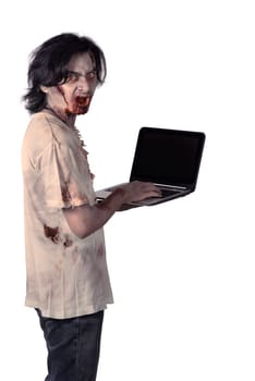 Creepy asian male zombie typing with laptop isolated over white background