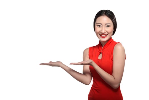 Asian woman in cheongsam dress isolated over white background. Happy chinese new year concept