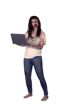 Female zombie holding laptop isolated over white background