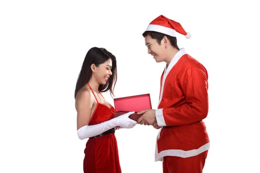 Lovely christmas couple open present isolated over white background