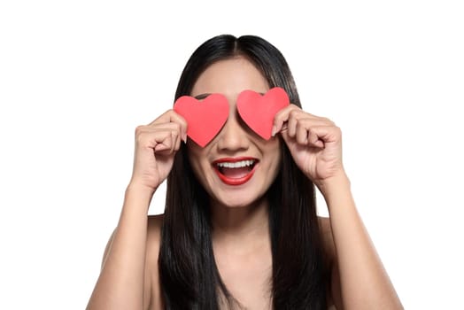 Valentine day concept. Beautiful asian girl holding red heart