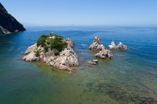Aerial view over a small island in the ocean