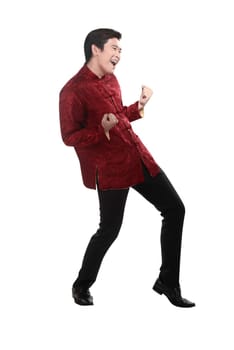 Young chinese man in cheongsam suit isolated over white background