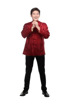 Young chinese man in cheongsam suit isolated over white background