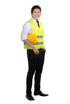 Asian worker wearing safety vest and yellow helmet isolated over white background