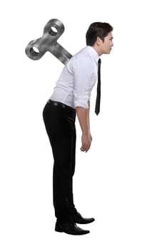 Asian business man have winding key on his back isolated over white background