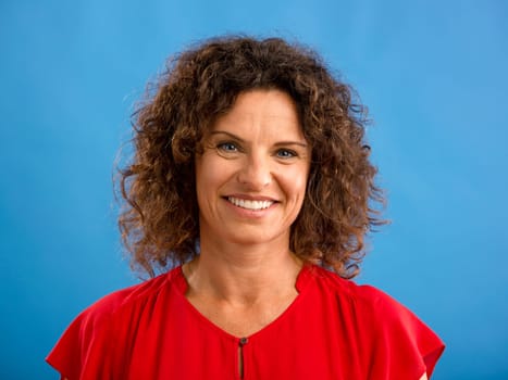 Portrait of a beautiful woman over a blue background