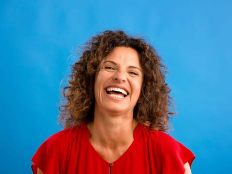 Portrait of a beautiful woman over a blue background