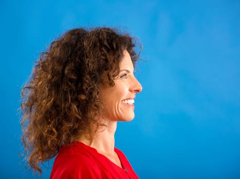Portrait of a beautiful woman over a blue background