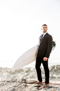 A Businessman holding is surfboard after a long day of work