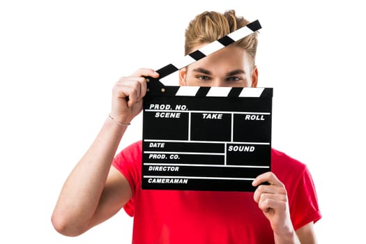 Portrait of a handsome young man wolding a clapboard