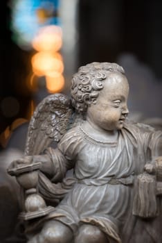 White statue of angel boy in church. Sweden, Scandinavia. Europe travel.